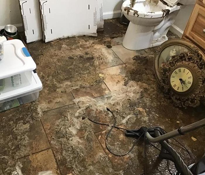 Sewage back-up that spilled over the tile floor