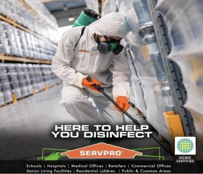 SERVPRO technician spraying disinfectant 