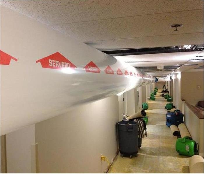 Commercial hallway with drying equipment set up